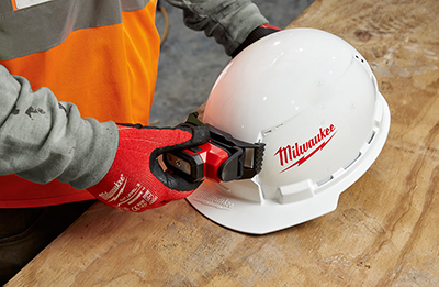 A Milwaukee headlamp is attached to the Milwaukee Front Brim Vented Type-1 Hard Hat.