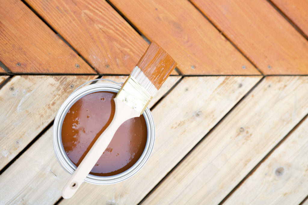 treated deck being stained