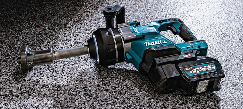 Makita GWT10T Impact Wrench lying on a garage floor.